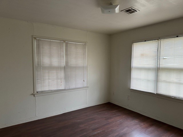 1713 N Quapah Avenue, Oklahoma City, OK 73107 empty room with dark hardwood / wood-style flooring
