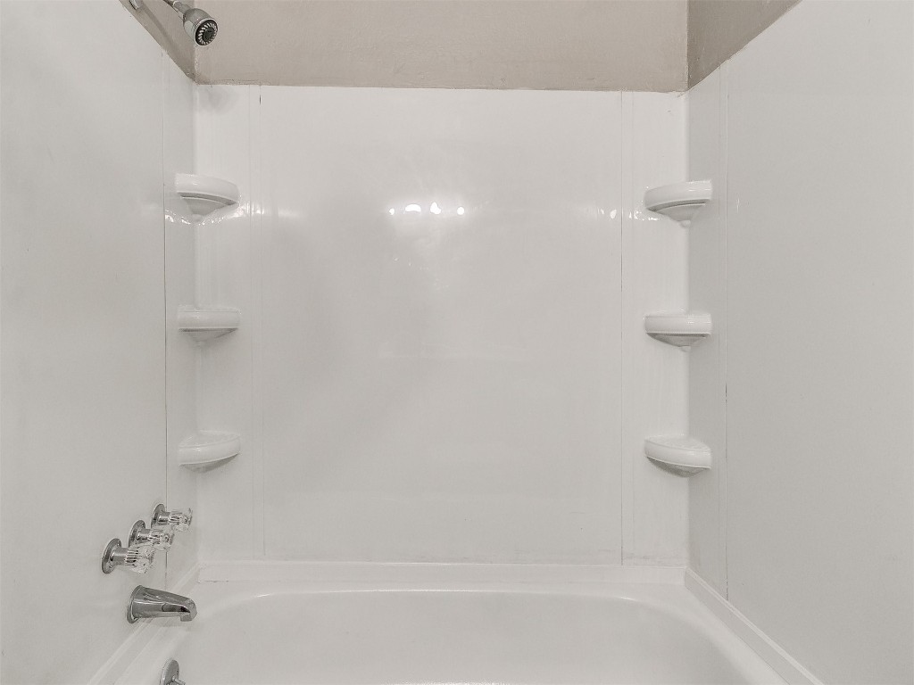 808 NW 113th Street, Oklahoma City, OK 73114 bathroom featuring shower / bathing tub combination