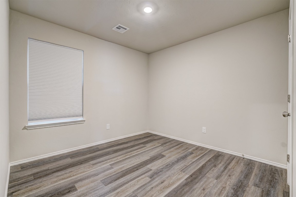 11920 Annette Drive, Yukon, OK 73099 unfurnished room featuring dark hardwood / wood-style flooring