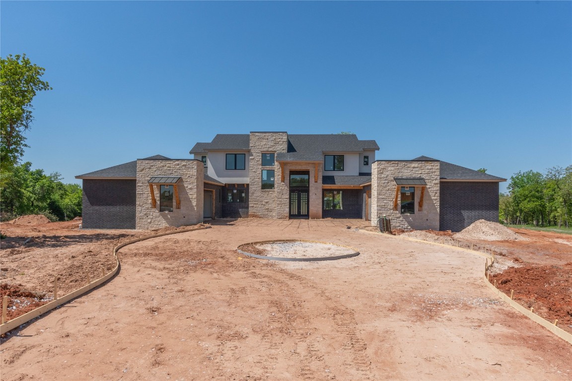 Indulge in luxury living at this stunning new construction home in North Edmond. Featuring a versatile layout designed for comfort and functionality, this residence offers a perfect blend of privacy and togetherness. Step inside to discover grandeur in every detail, from the soaring ceilings to the abundant natural light. The main level balances openness with private spaces. Find a welcoming atmosphere for gatherings in the spacious living areas, while a primary suite and an additional bedroom provide a peaceful retreat. Upstairs, discover tranquility in the well-appointed bedrooms. Outside, a sprawling backyard beckons for outdoor relaxation. Meticulously crafted with top-of-the-line finishes, including 2 tankless water heaters and a reverse osmosis water purifier, this home epitomizes modern elegance. Schedule your private tour today and elevate your lifestyle to extraordinary heights.