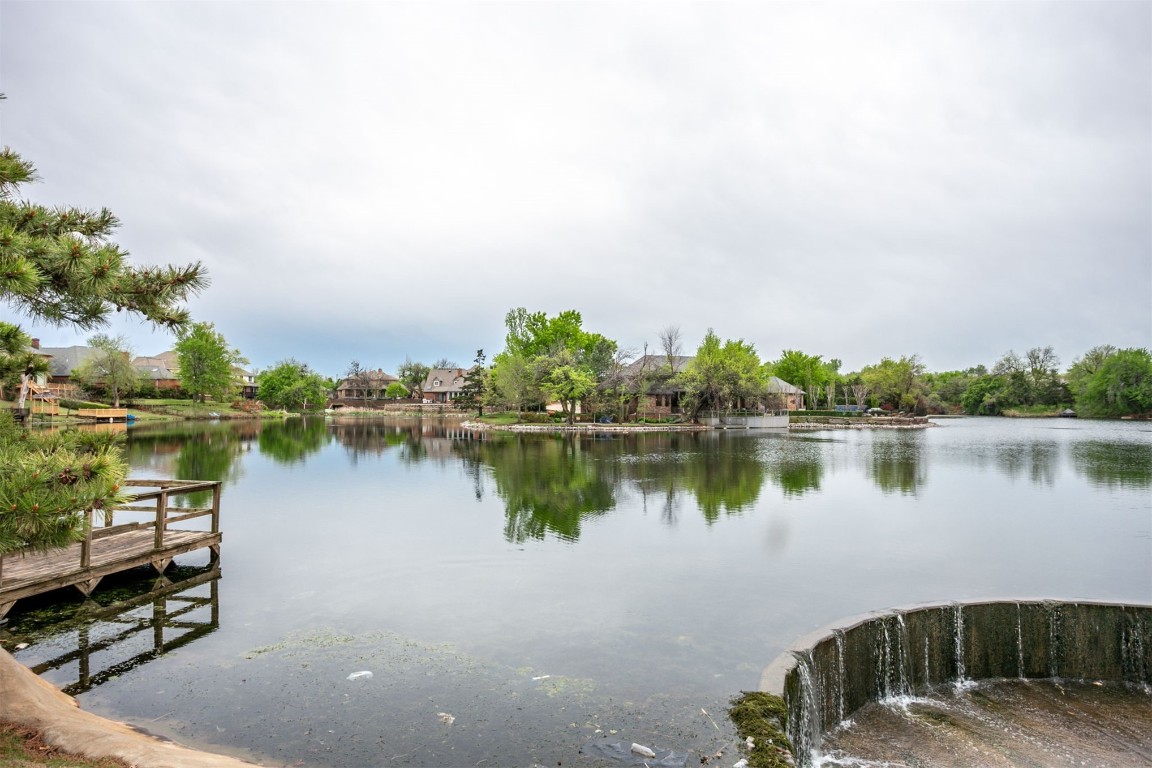 6201 Inland Road, Warr Acres, OK 73132 dock area featuring a water view