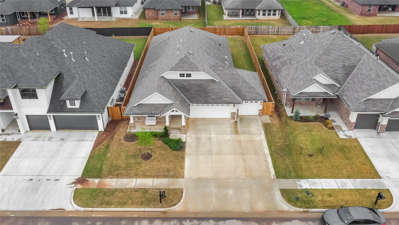 6516 NW 148th Street, Oklahoma City, OK 73142 view of drone / aerial view