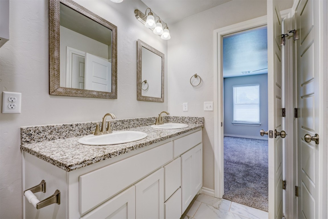 340 NW 97th Street, Oklahoma City, OK 73114 bathroom with double sink vanity and tile flooring