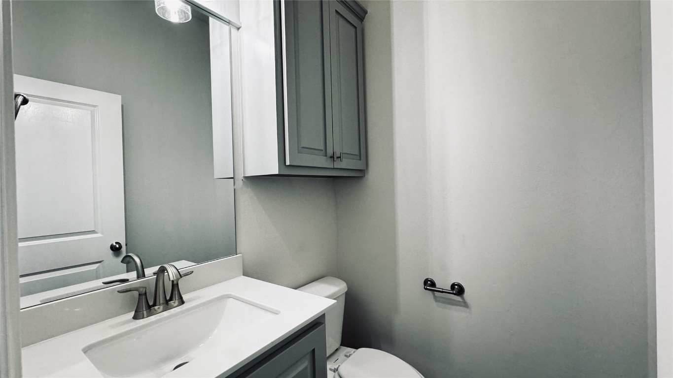 9325 SW 45th Court, Oklahoma City, OK 73179 bathroom featuring toilet and vanity