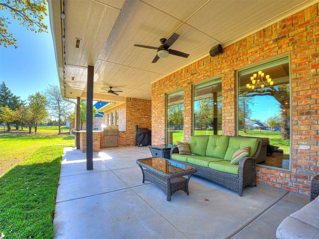 1965 Ladera Lane, Edmond, OK 73034 view of patio featuring a grill, outdoor lounge area, ceiling fan, and area for grilling