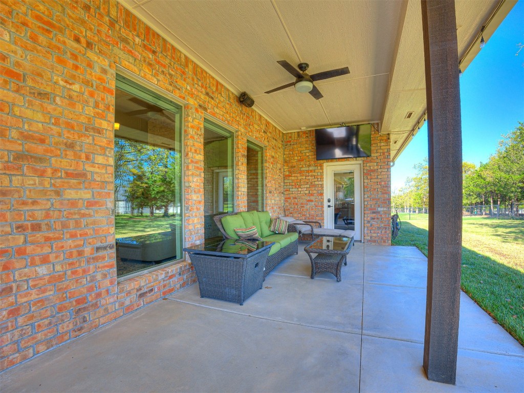 1965 Ladera Lane, Edmond, OK 73034 view of patio featuring ceiling fan and an outdoor hangout area