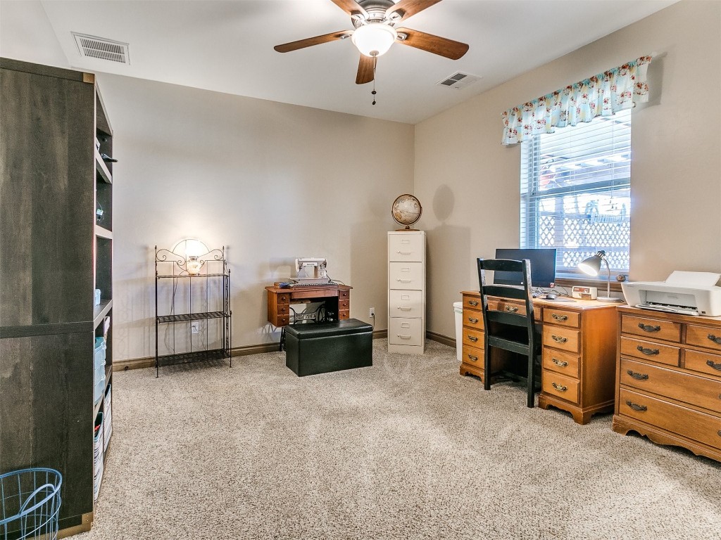 2350 Gina Court, Guthrie, OK 73044 office area with light carpet and ceiling fan