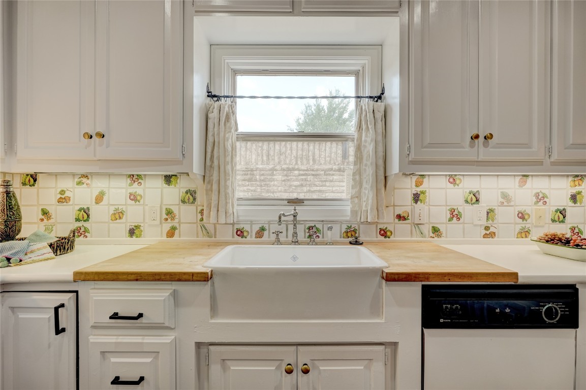 6324 Harden Drive, Oklahoma City, OK 73118 kitchen with backsplash, wooden counters, white dishwasher, and white cabinets