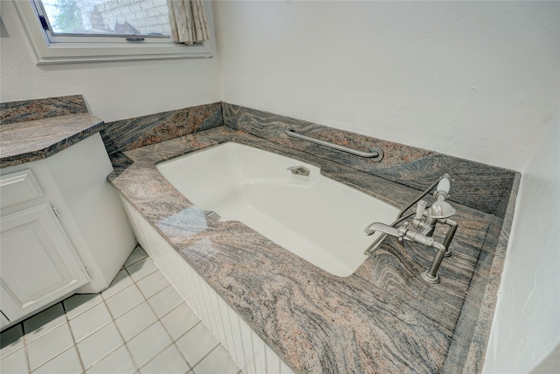 6324 Harden Drive, Oklahoma City, OK 73118 bathroom with tile floors and a washtub