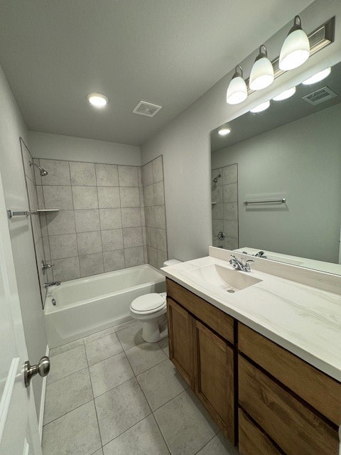 405 Vista Drive, Yukon, OK 73099 full bathroom with tile flooring, vanity, tiled shower / bath combo, and toilet