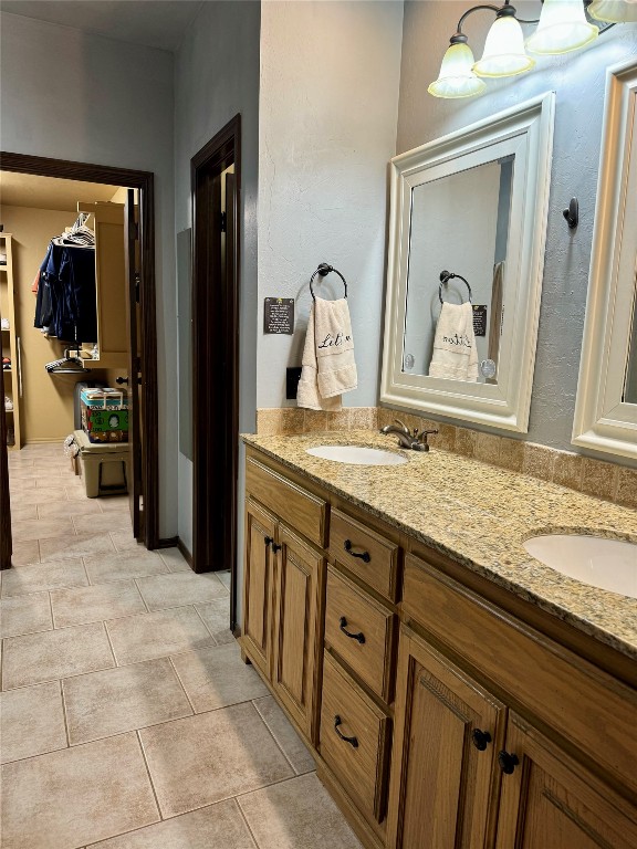 13105 Bright Prairie Circle, Oklahoma City, OK 73142 bathroom featuring tile floors and dual bowl vanity