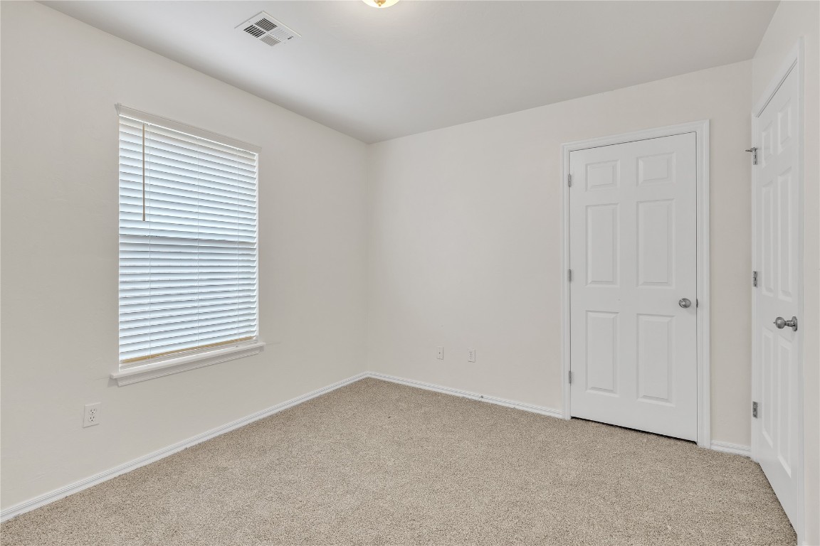 11119 SW 5th Street, Yukon, OK 73099 carpeted spare room with a healthy amount of sunlight
