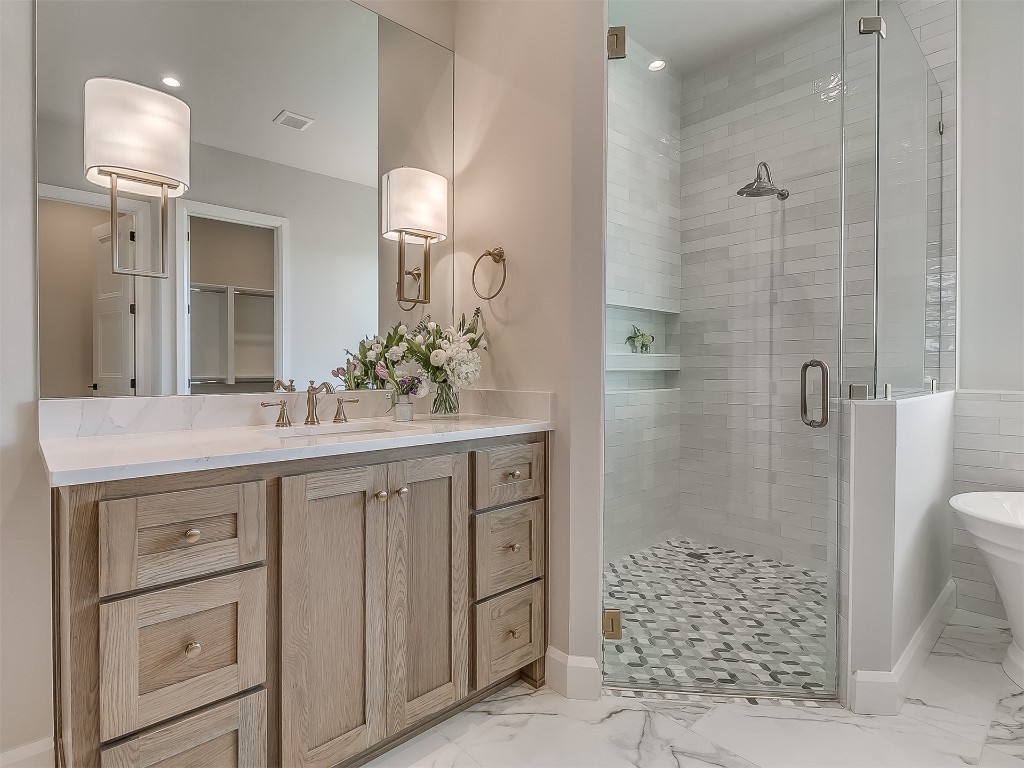 2201 Pallante Street, Edmond, OK 73034 bathroom featuring vanity, an enclosed shower, and tile floors