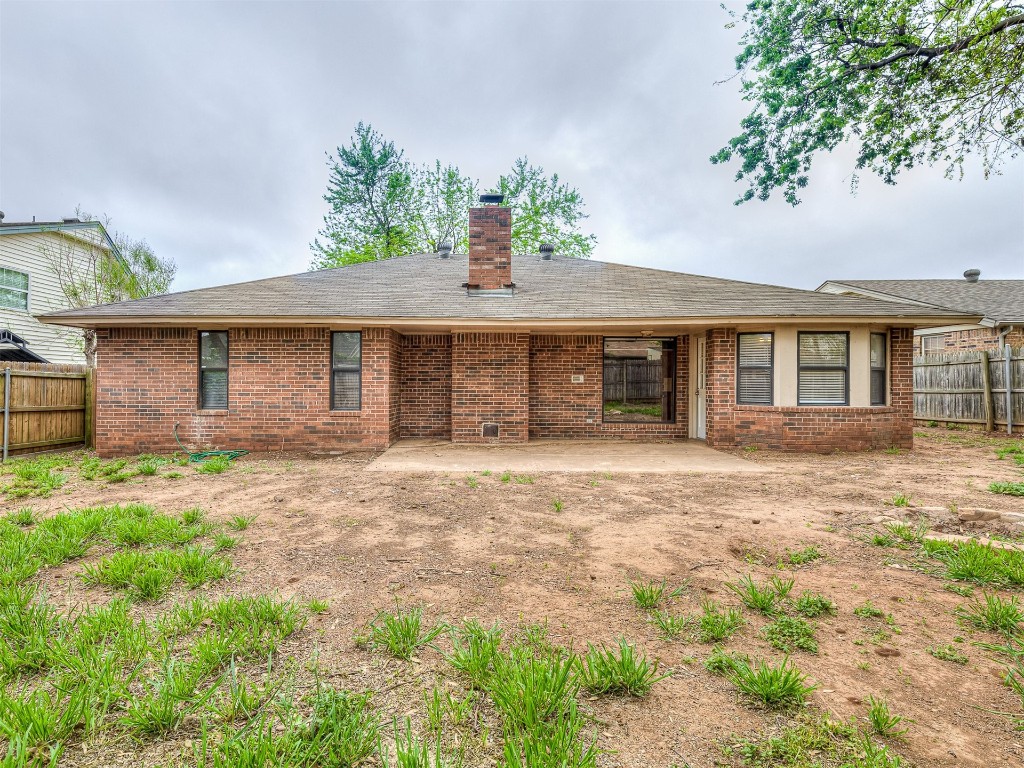 1521 NE 3rd Street, Moore, OK 73160 back of house with a patio
