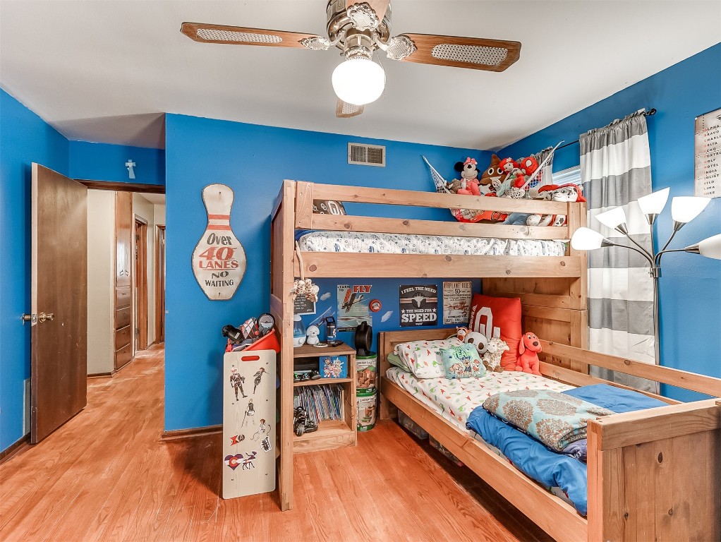 639 Ridgecrest Road, Edmond, OK 73013 bedroom with light hardwood / wood-style floors and ceiling fan