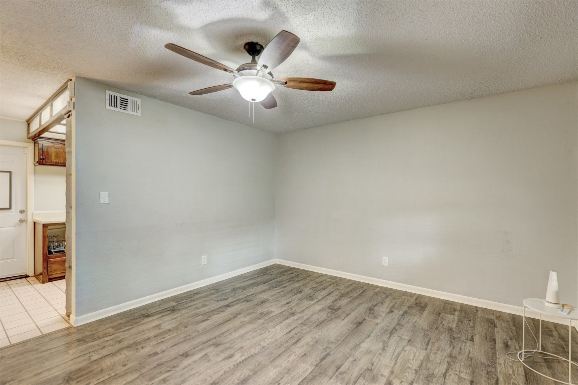 704 Juniper Avenue, Midwest City, OK 73130 tiled spare room with ceiling fan and a textured ceiling