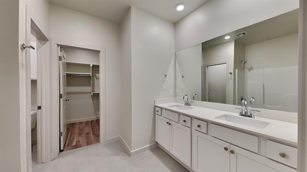 3809 N DIVIS Avenue, Bethany, OK 73008 bathroom featuring walk in shower, dual sinks, tile floors, and large vanity
