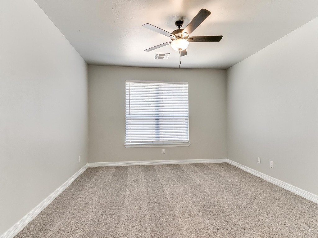 11000 Treemont Lane, Oklahoma City, OK 73162 carpeted spare room with ceiling fan