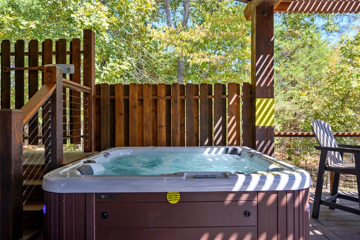41 Oak Creek Trail, Broken Bow, OK 74728 wooden deck featuring a hot tub