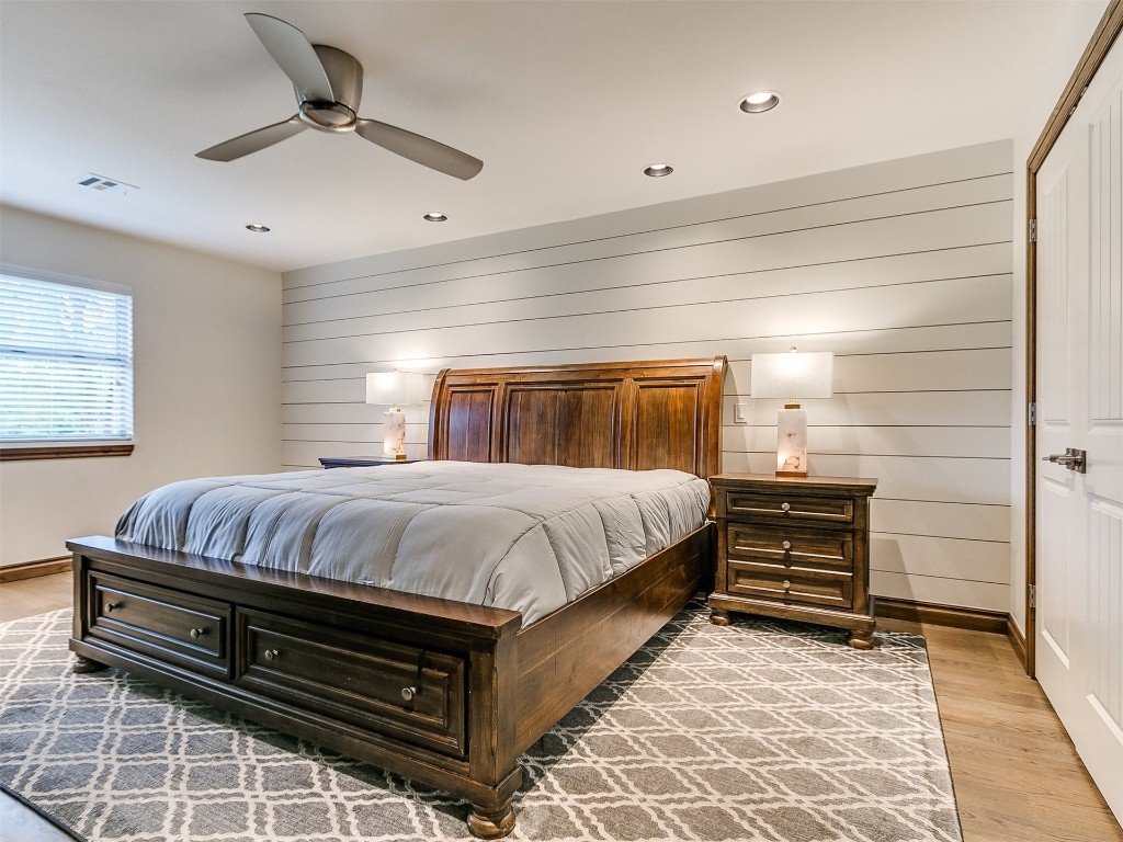 609 S Chloe Lane, Mustang, OK 73064 bedroom featuring a closet, light hardwood / wood-style floors, and ceiling fan