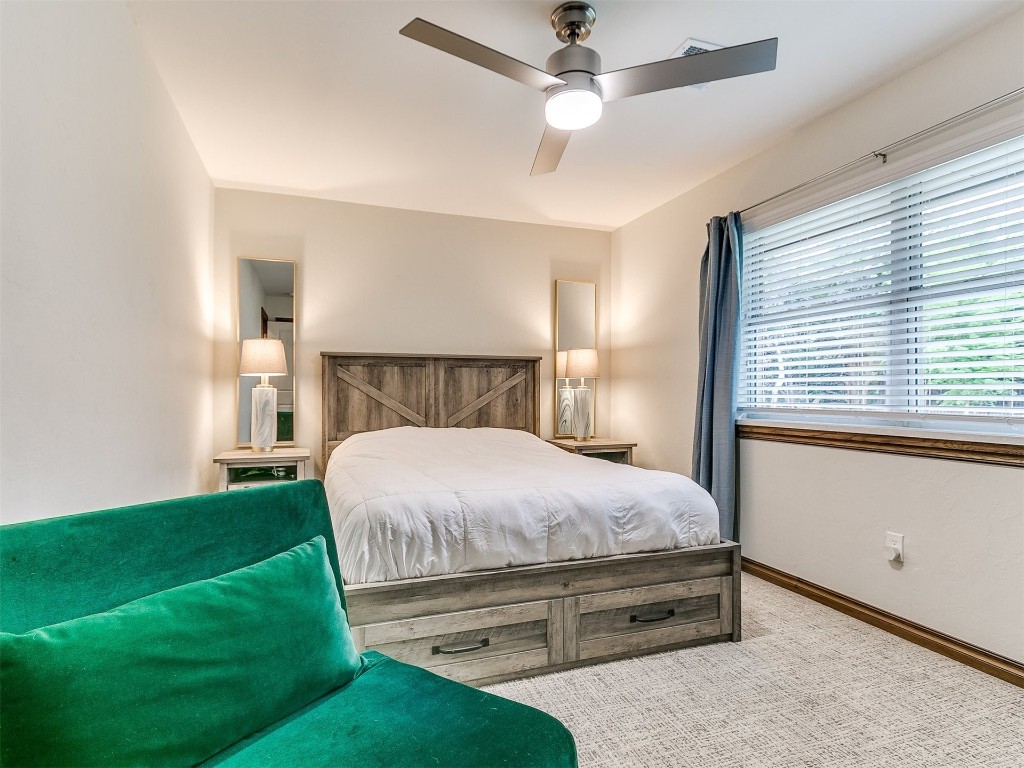 609 S Chloe Lane, Mustang, OK 73064 carpeted bedroom with ceiling fan