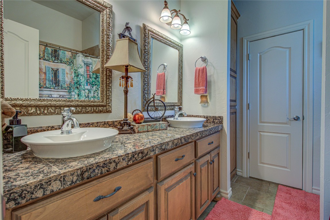 4209 Heavenfield Court, Edmond, OK 73034 bathroom featuring double sink, tile flooring, and large vanity