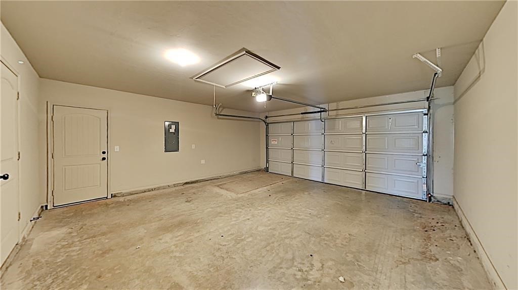 12728 NW 137th Street, Piedmont, OK 73078 garage featuring a garage door opener