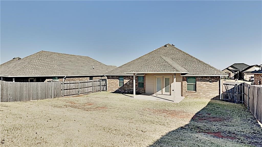 12728 NW 137th Street, Piedmont, OK 73078 rear view of house featuring a patio