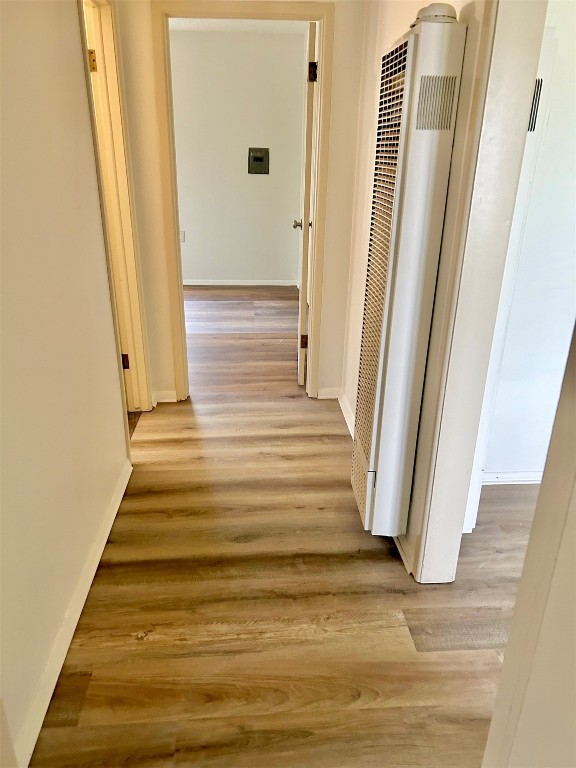 1216 NE 68th Street, Oklahoma City, OK 73111 hallway featuring light hardwood / wood-style flooring