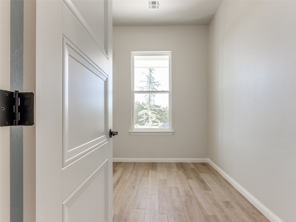 9009 NE 139th Street, Jones, OK 73049 empty room with light wood-type flooring