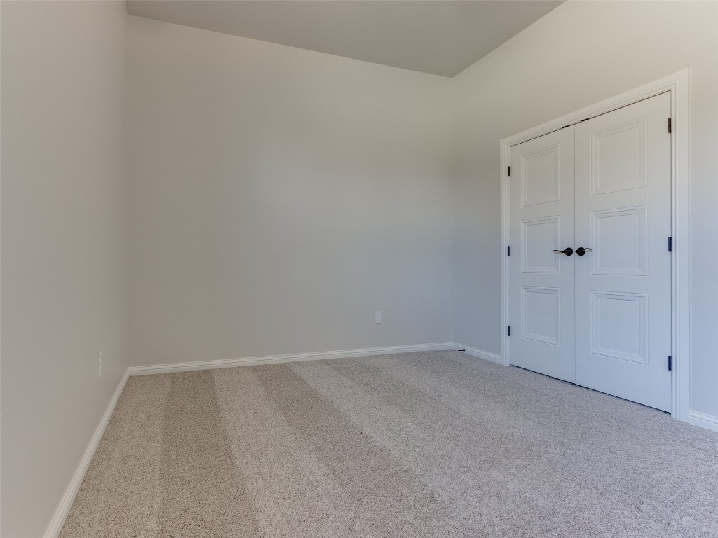 9009 NE 139th Street, Jones, OK 73049 interior space with light colored carpet and a closet
