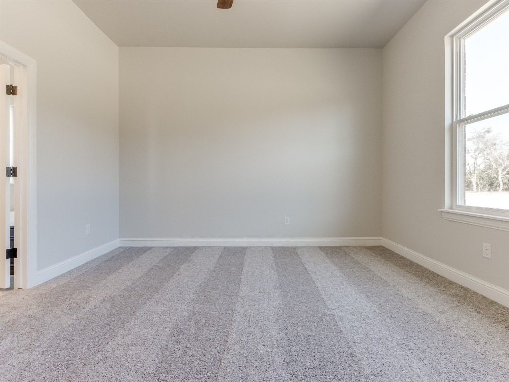 9009 NE 139th Street, Jones, OK 73049 empty room with light colored carpet