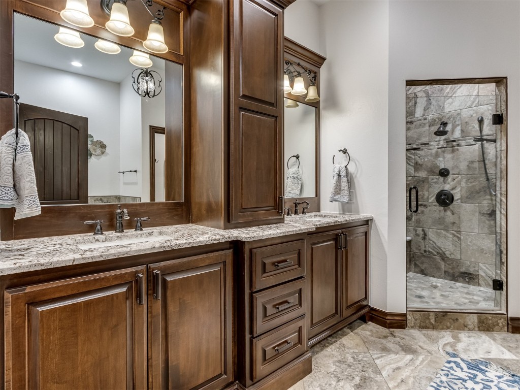 9701 Nawassa Drive, Midwest City, OK 73130 bathroom featuring double vanity, an enclosed shower, and tile floors
