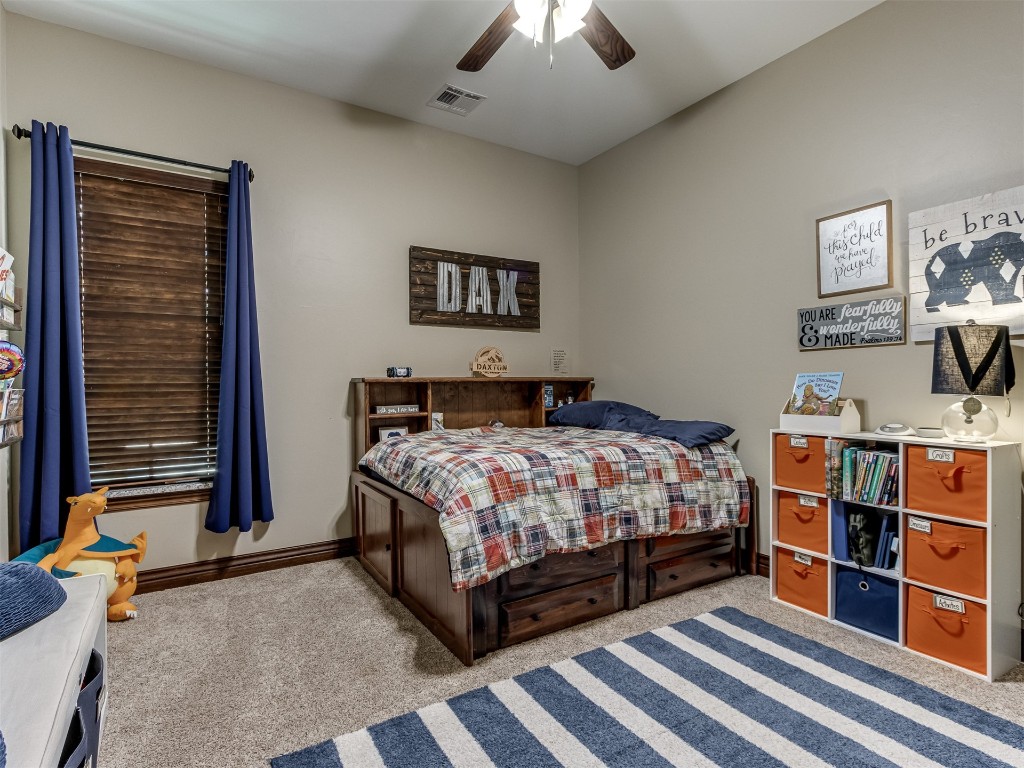 9701 Nawassa Drive, Midwest City, OK 73130 carpeted bedroom with ceiling fan