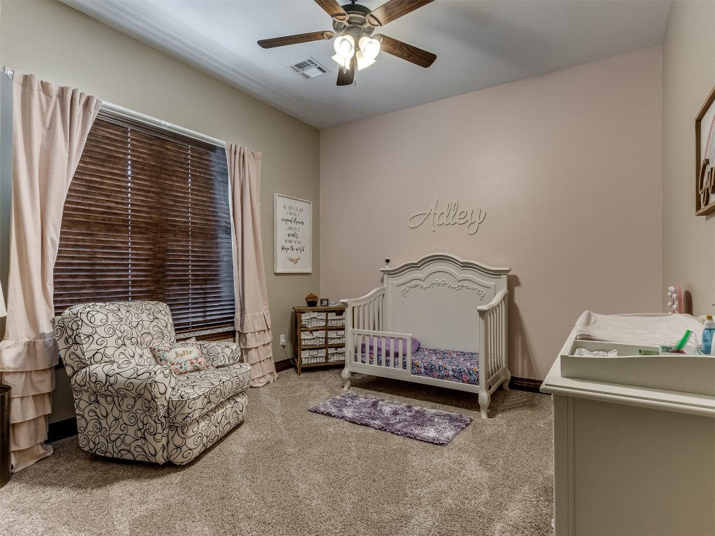 9701 Nawassa Drive, Midwest City, OK 73130 bedroom featuring ceiling fan and carpet flooring