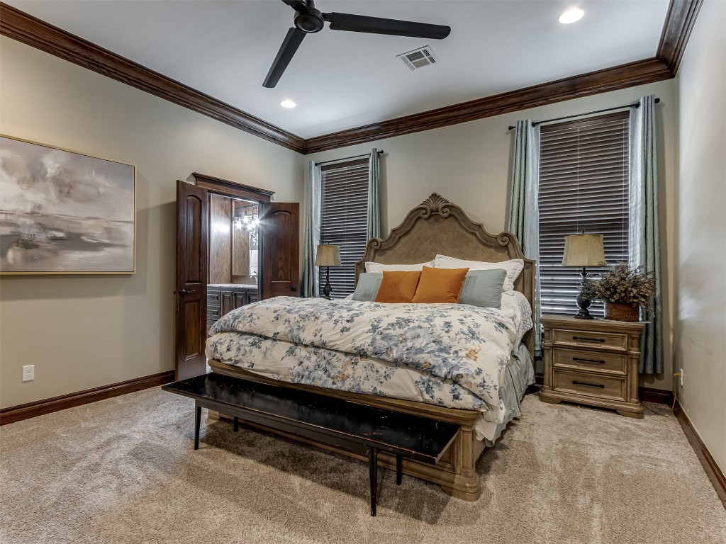 9701 Nawassa Drive, Midwest City, OK 73130 carpeted bedroom featuring ceiling fan and crown molding