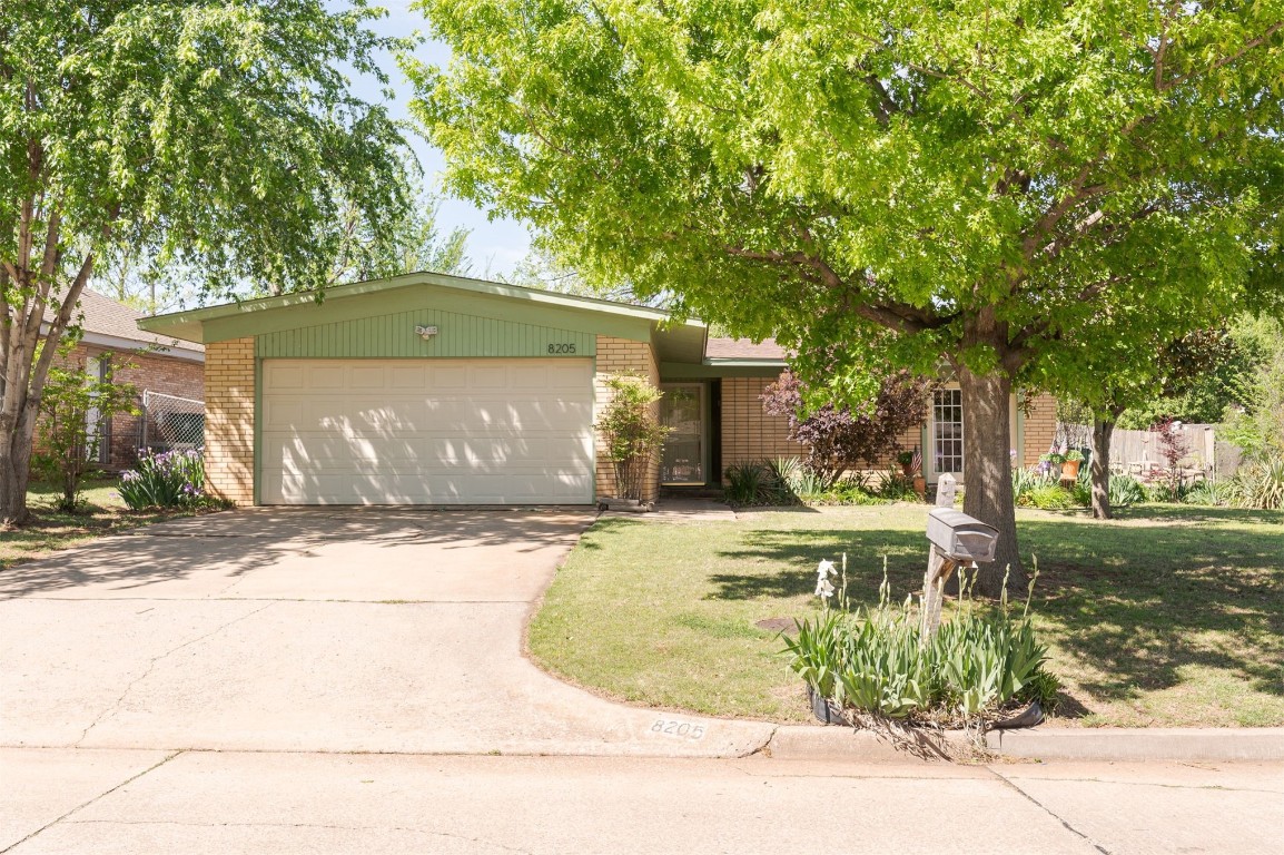 Welcome home to 8205 Brookside Drive - a RARE 1/3 acre lot (mol) in the heart of OKC. What a charming home in a quiet neighborhood, which present so many opportunities to make it your own. Whether you are a home owner seeking to build long term equity, or an investor looking to make a few quick updates- this home is perfect for what you need! 

The home was completely brought down to the studs in 2007. Since then, it has received cosmetic updates, and mechanical updates including a new HVAC in 2018, and a new water heater in 2024. All HVAC ductwork has been ran overhead to eliminate floor ducts. 

The kitchen and bathrooms boast hand built solid wood cabinets- which were custom for the home, stainless steel appliances, and it also comes with a refrigerator which is in great working order. Step out onto the front porch from your double doors in the dining room, to enjoy a summer evening or your morning coffee. The operable wood burning fireplace will make your home cozy in the winter months. 

The sprawling back yard has been devotedly attended to with years of work poured into it. Notice the abundance of perennial flowers that will come back year after year. Enjoy your Peony garden, and your sprawling Daylilies, with a mature shade tree set up just right for a tire swing. You'll love the spacious back patio perfect for entertaining. The back yard also includes a storage shed to stow away all your gardening tools and mower. As an added bonus, you'll have quite a bit of privacy on the north side of the property. 

With this home you aren't just buying a property- you are buying a lifestyle. It won't last long, schedule your showing today.