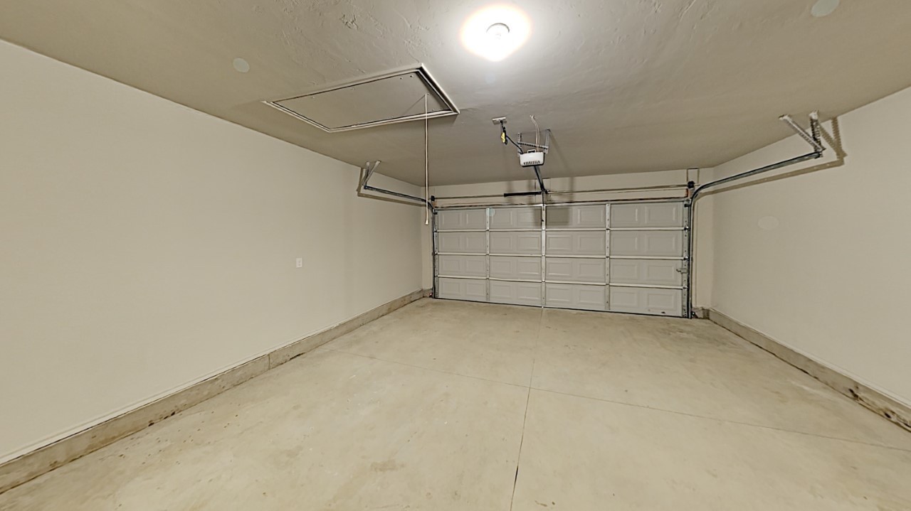 10716 NW 18th Street, Yukon, OK 73099 garage with a garage door opener