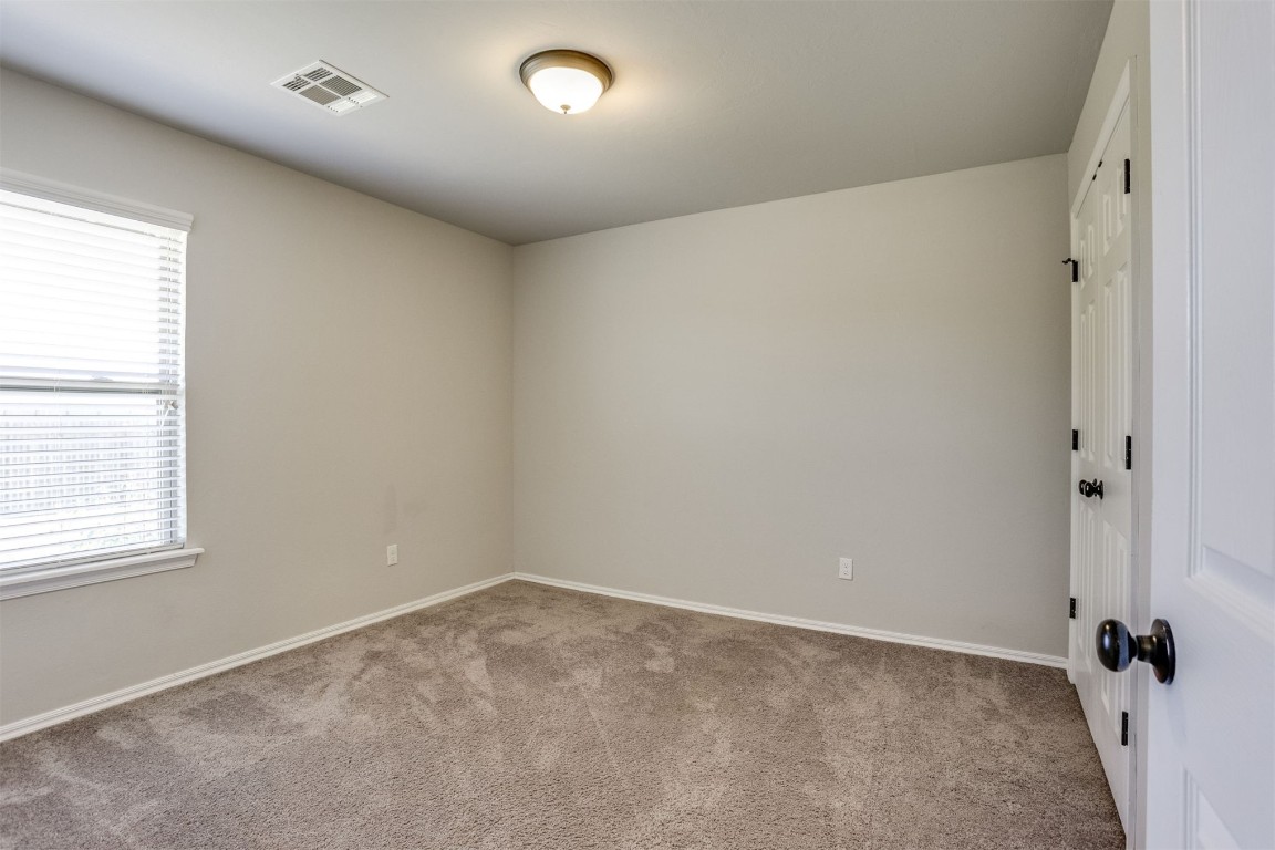 5604 Marblewood Drive, Oklahoma City, OK 73179 unfurnished room with light colored carpet