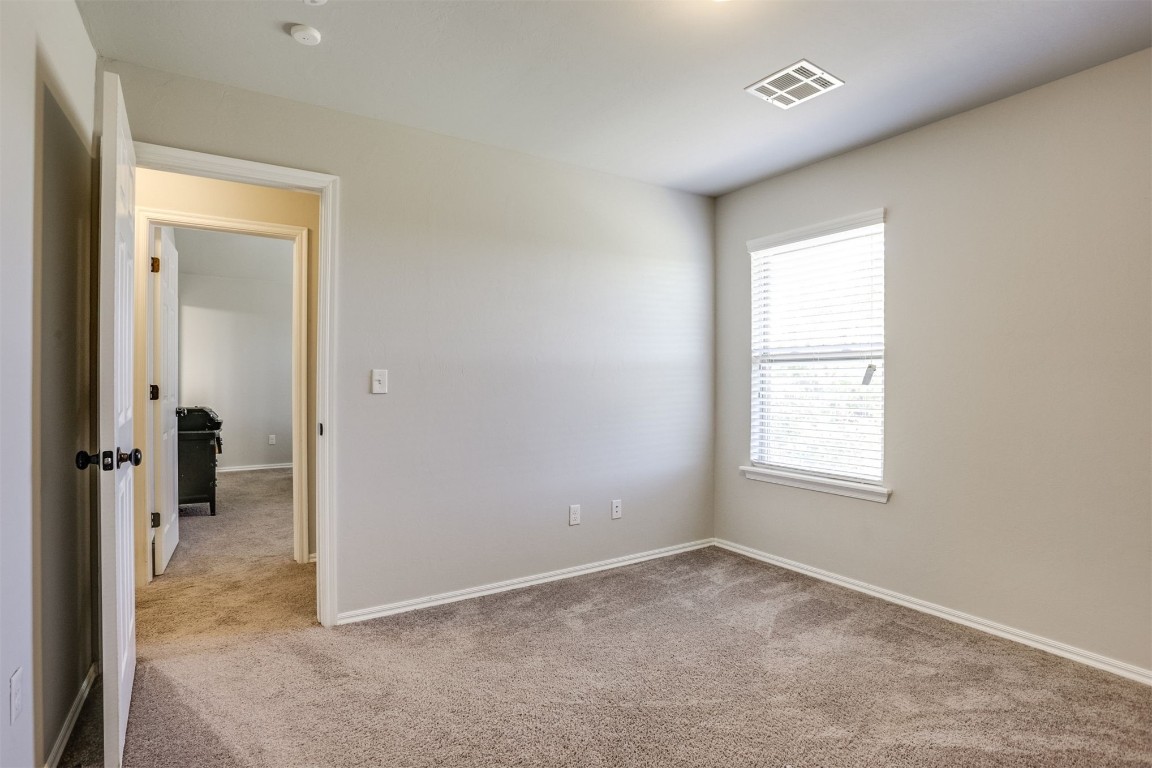 Address Hidden spare room featuring light colored carpet