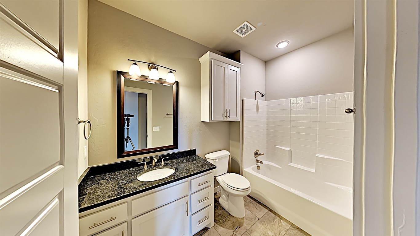 416 Charles Court, Yukon, OK 73099 full bathroom with tile flooring, shower / bath combination, vanity, and toilet