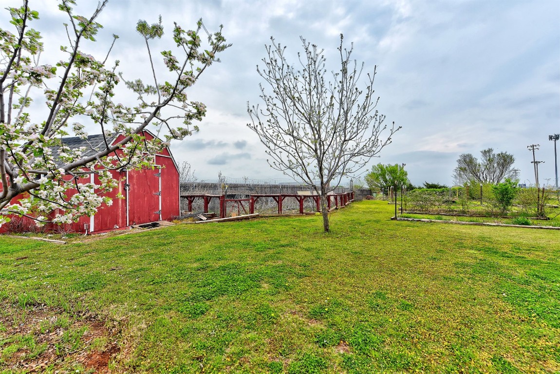 1416 NW Craig Drive, Piedmont, OK 73078 view of yard with an outdoor structure