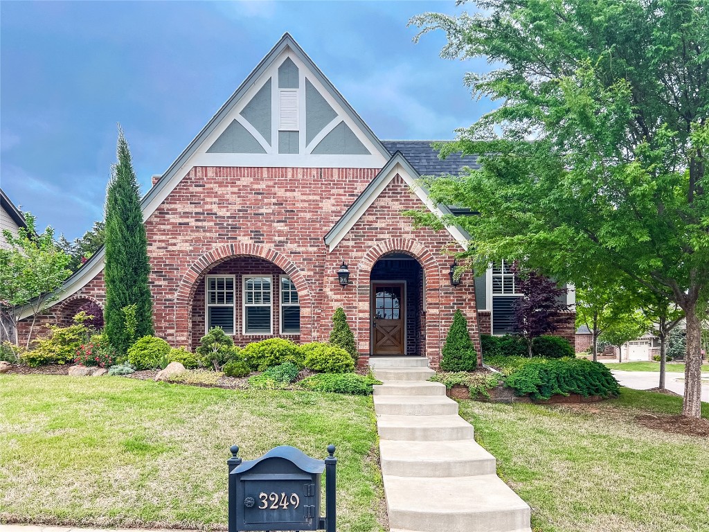 Take a step back in time with this stunning English Tudor styled home in our popular Town Square neighborhood! Inside is perfectly designed to entertain with open views into every room. You will fall in love with this plan with a study, 3 Pinterest-worthy bathrooms, and a stunning brick fireplace with a cathedral ceiling accented with beams and shiplap in the living room. The U-shaped kitchen has wonderful cabinet storage, fridge that comes with the home and an island with the sink looking into the dining space. The primary suite features his & her vanities, oversized shower and a walk-in closet. You will never want to leave your back patio with built-in grill, fire pit, heaters and stone water feature. Home comes with fridge as well as washer and dryer. Town Square is Edmond's historically inspired community featuring Town Square Residents Club, resort-style pool, fitness center, youth rec center, playground, community garden, wooded green belt with walking trails, and a lake with fishing dock.