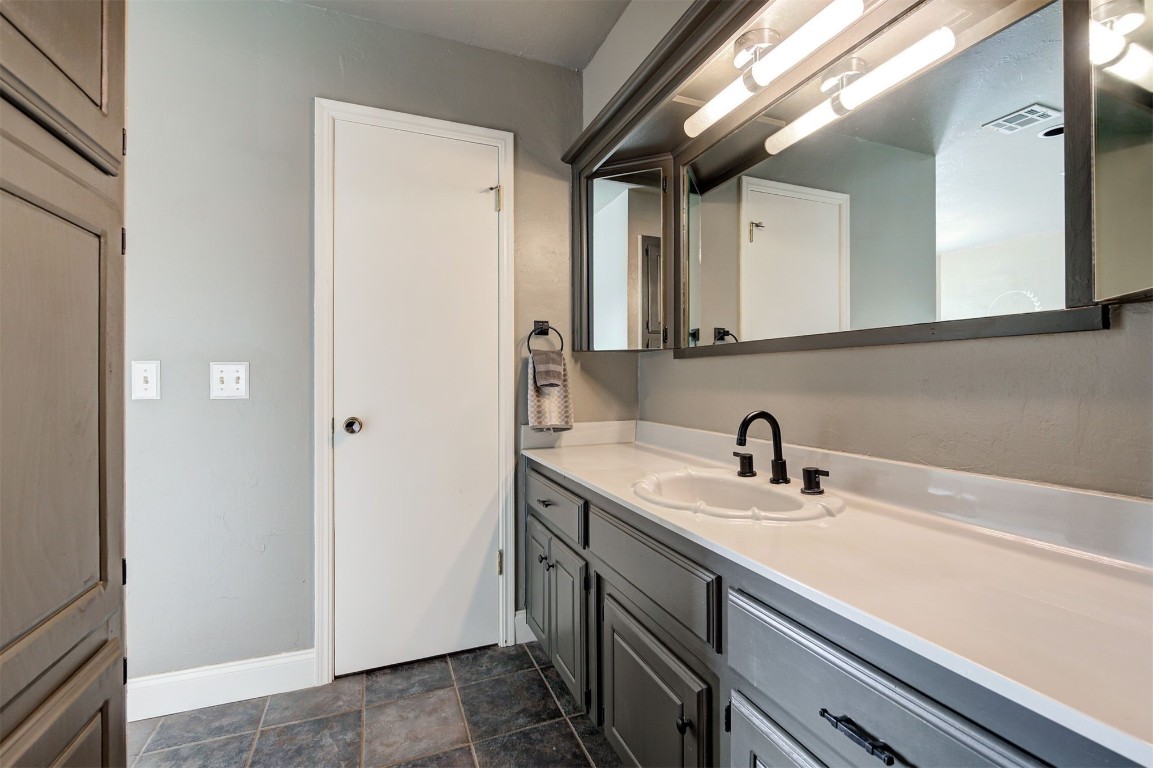 6712 Briarcreek Drive, Oklahoma City, OK 73162 bathroom with vanity and tile floors