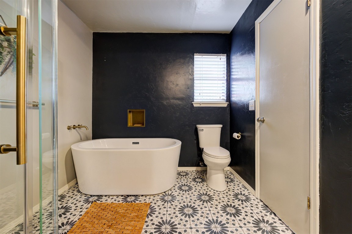 6712 Briarcreek Drive, Oklahoma City, OK 73162 bathroom with toilet and tile floors