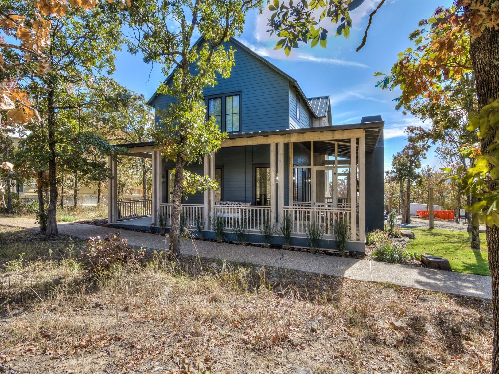 96 Walk in the Woods Lane, Carlton Landing, OK 74432 farmhouse inspired home featuring covered porch