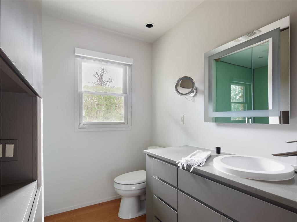 6614 N Pennsylvania Avenue, Nichols Hills, OK 73116 bathroom featuring toilet, hardwood / wood-style floors, and large vanity