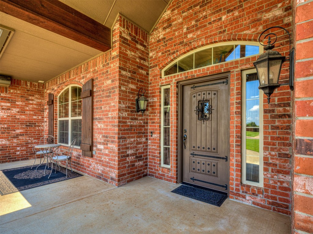 519 Harold Drive, #NE, Piedmont, OK 73078 property entrance featuring covered porch