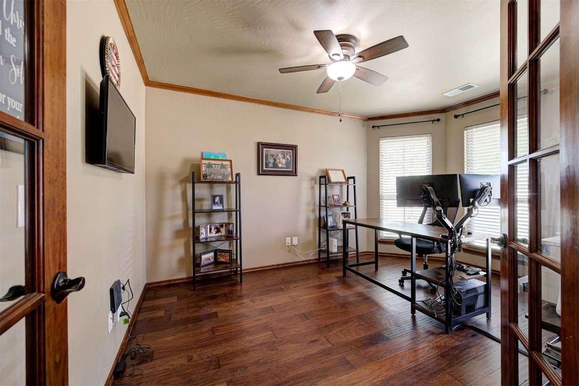 17208 Prado Drive, Oklahoma City, OK 73170 office with ornamental molding, dark hardwood / wood-style flooring, and ceiling fan