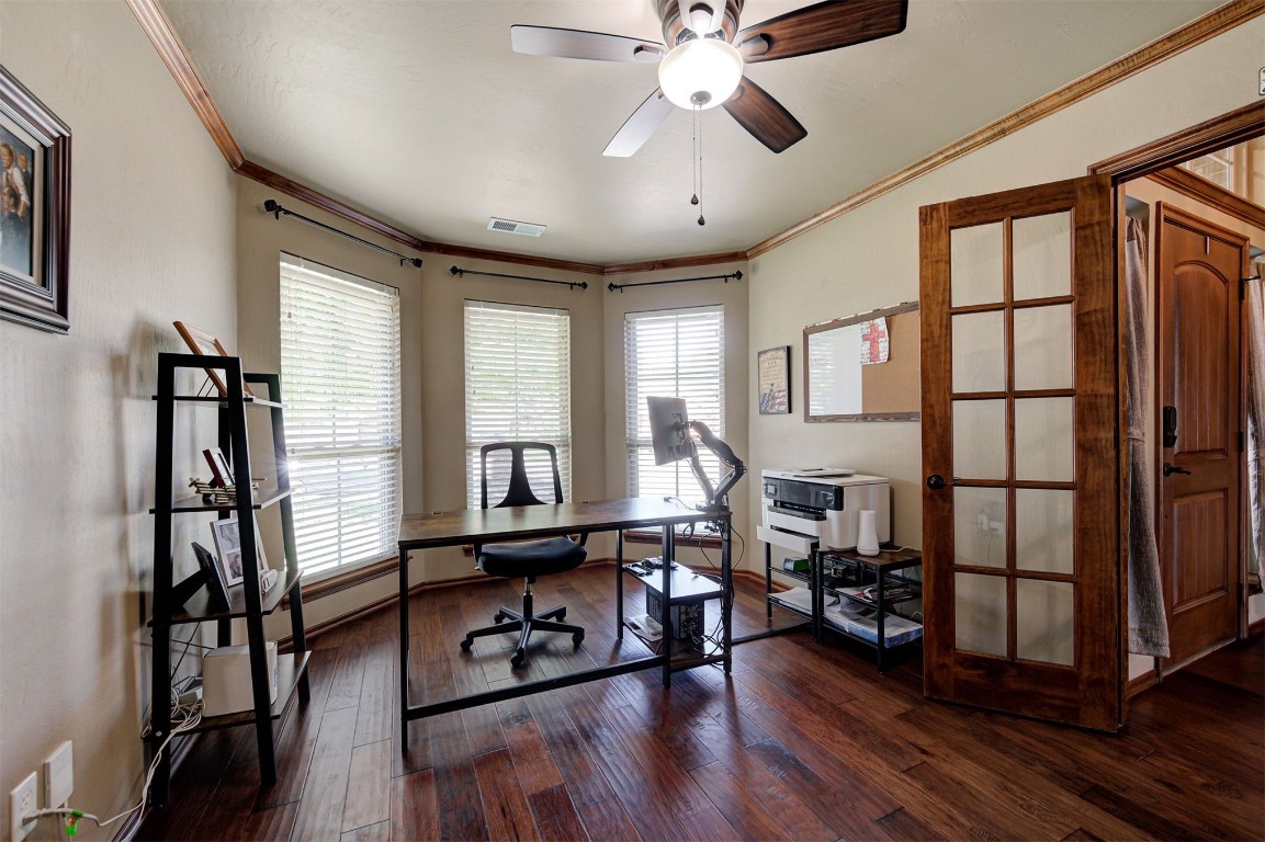 17208 Prado Drive, Oklahoma City, OK 73170 office area featuring ornamental molding, ceiling fan, and dark hardwood / wood-style floors